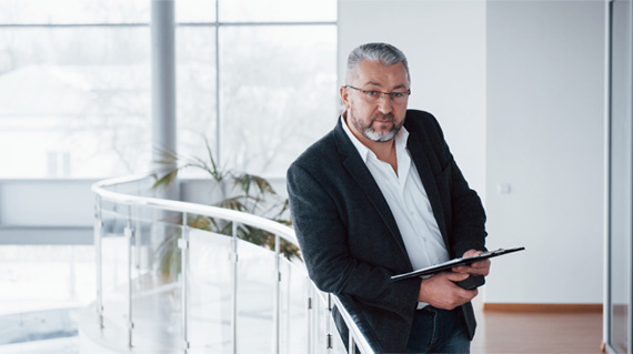 Executive man holding a tablet